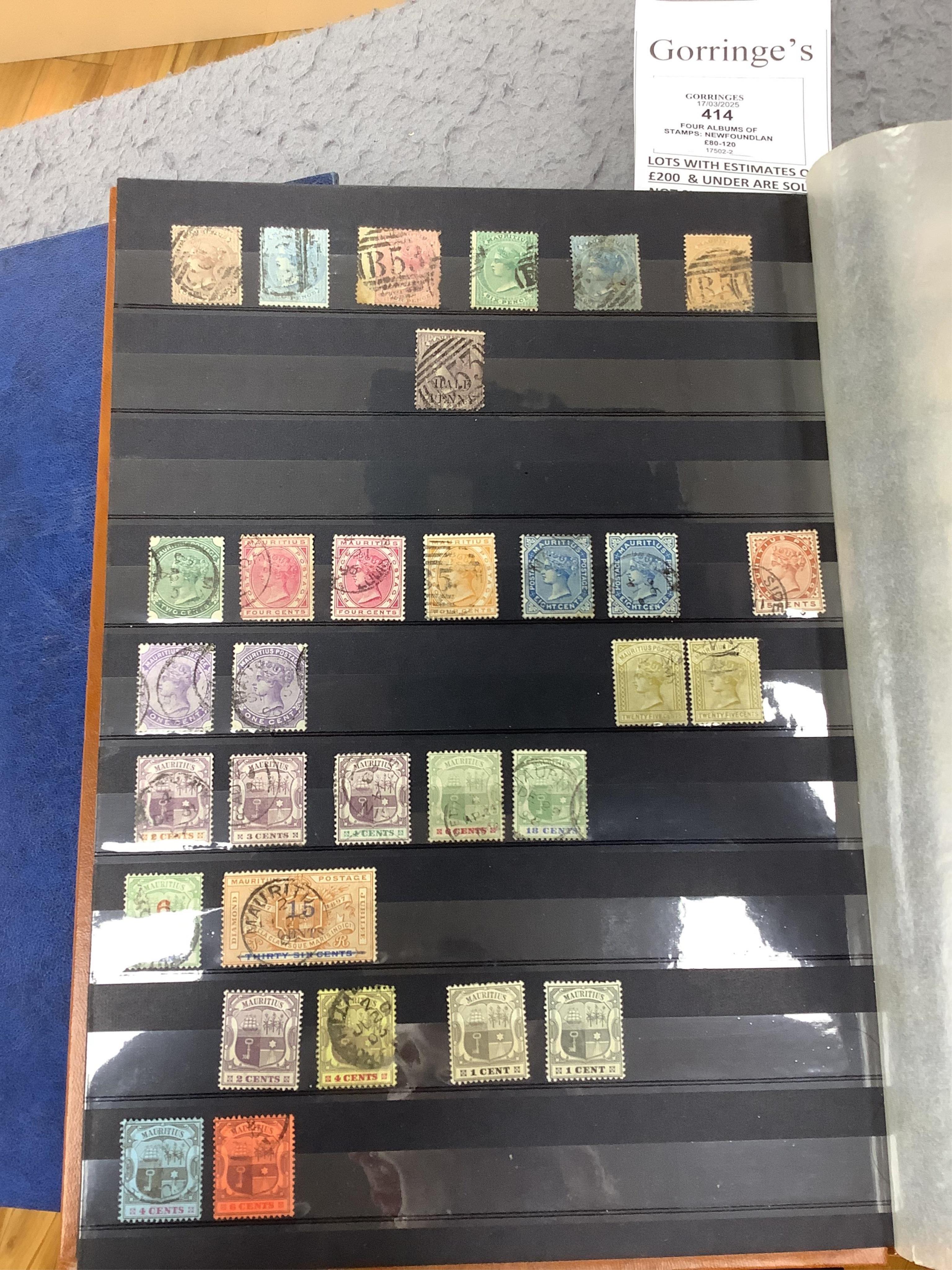 Four albums of stamps: Newfoundland, Jamaica etc (4). Condition - mostly stamp marked